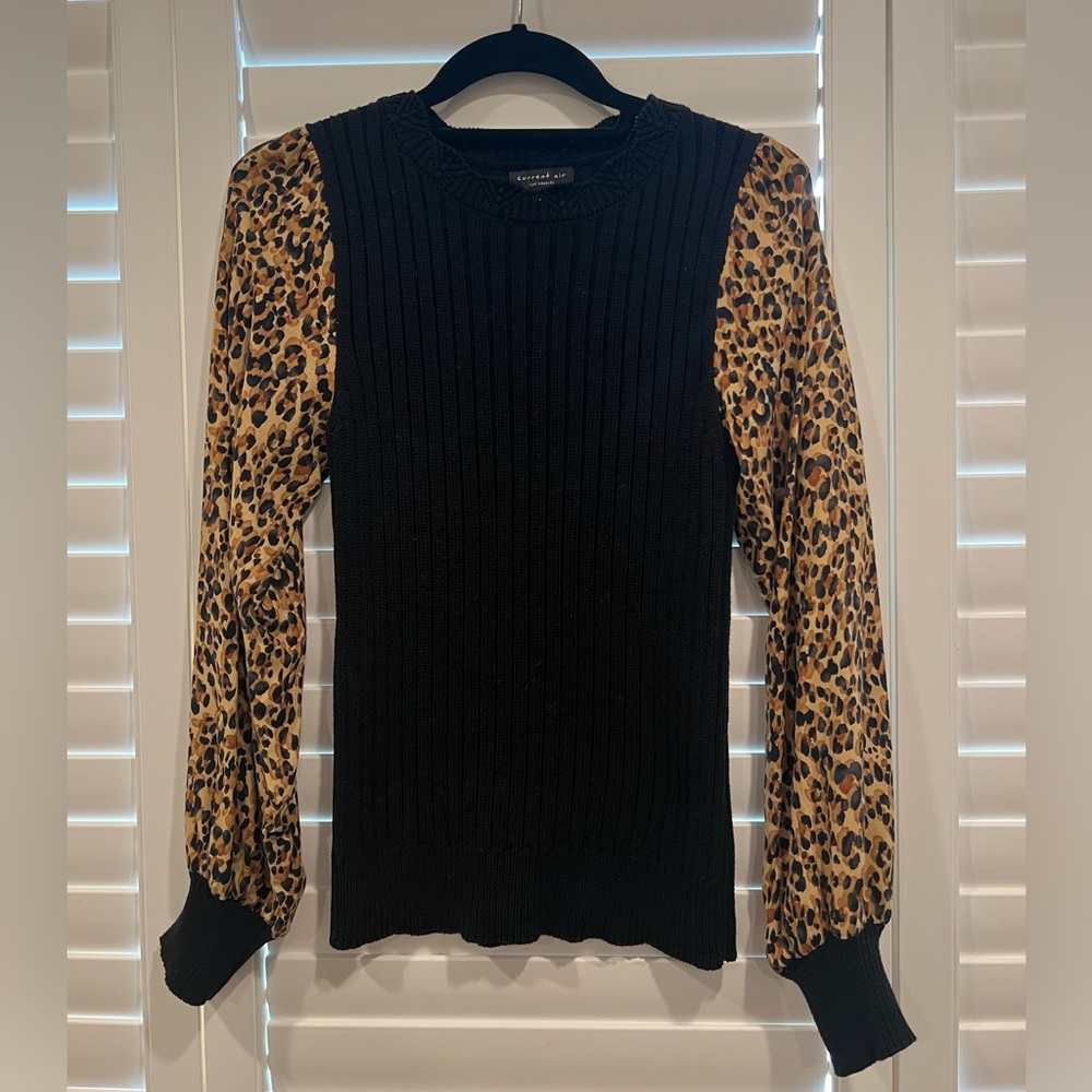 Boutique brand black sweater with leopard sleeves